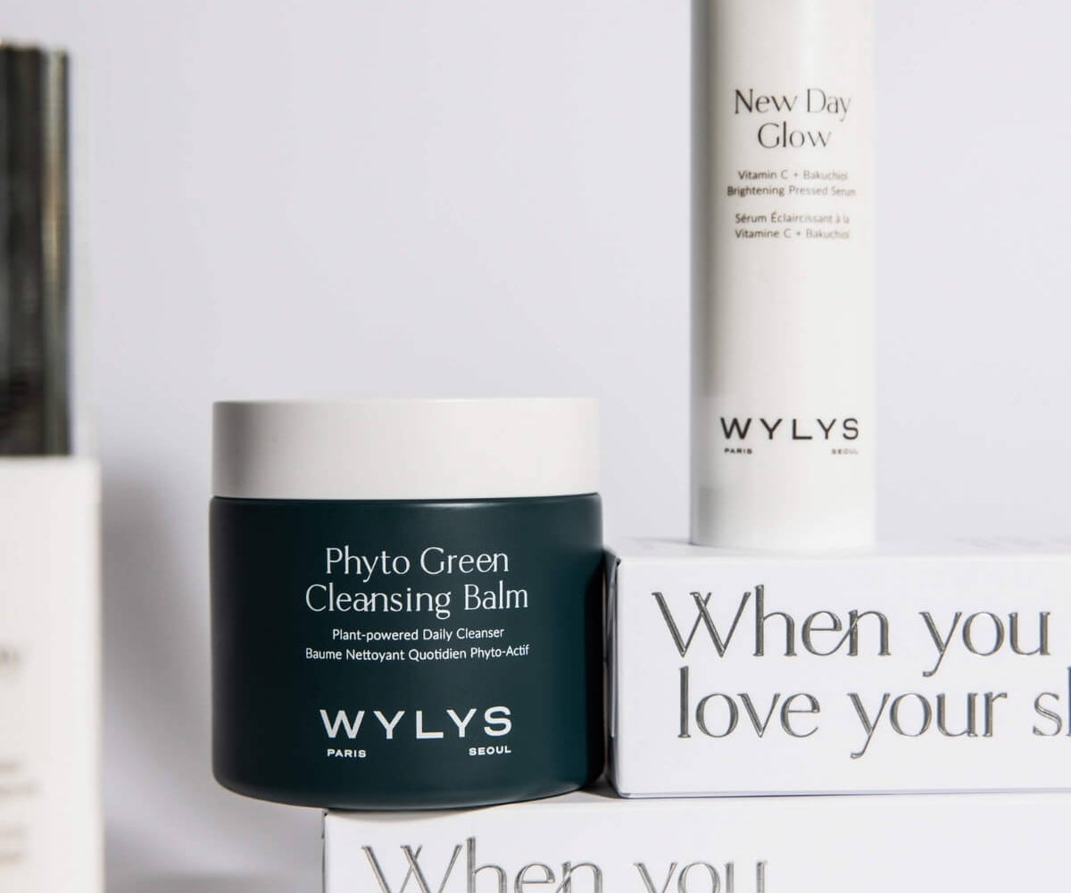 WYLYS skincare set featuring Phyto Green Cleansing Balm and New Day Glow Serum on branded white packaging boxes.