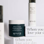 WYLYS skincare set featuring Phyto Green Cleansing Balm and New Day Glow Serum on branded white packaging boxes.