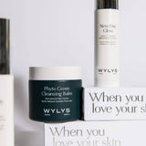 WYLYS skincare set featuring Phyto Green Cleansing Balm and New Day Glow Serum on branded white packaging boxes.
