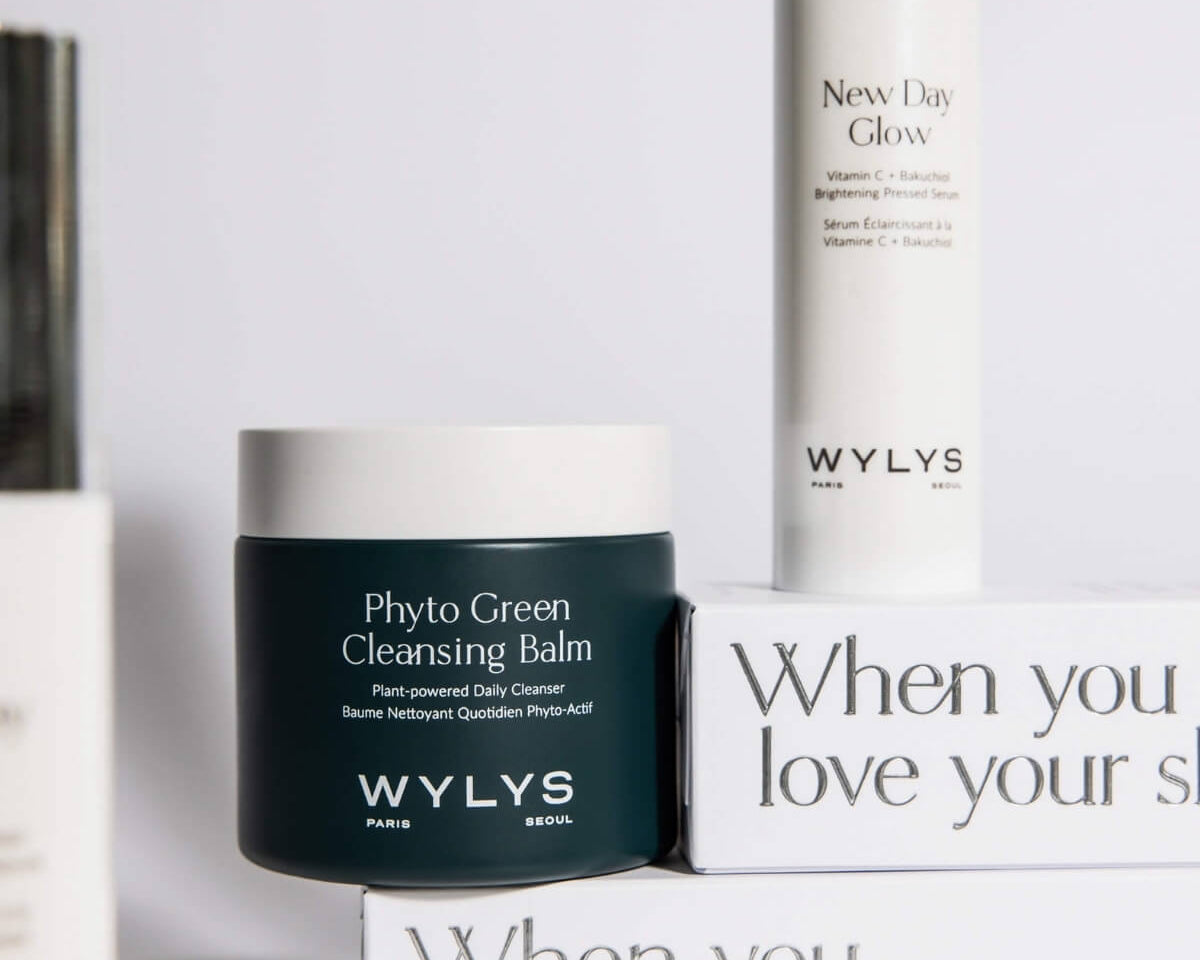 WYLYS skincare set featuring Phyto Green Cleansing Balm and New Day Glow Serum on branded white packaging boxes.