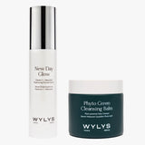 Studio product shot of WYLYS Daily Glow Duo: New Day Glow Serum and Phyto Green Cleansing Balm on white background.