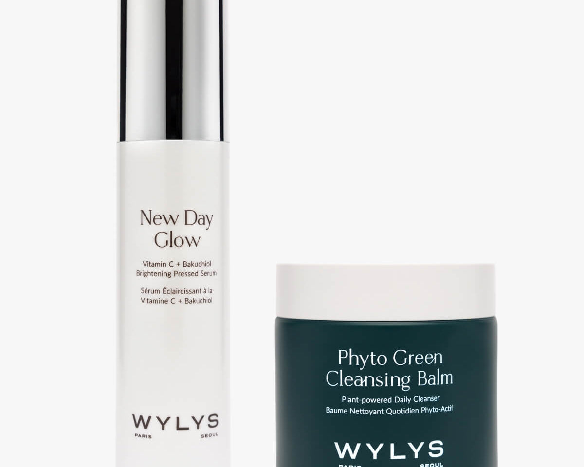 Studio product shot of WYLYS Daily Glow Duo: New Day Glow Serum and Phyto Green Cleansing Balm on white background.